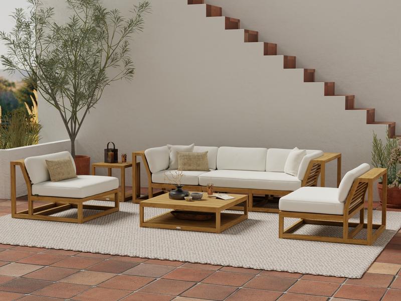 alt="70232 Maya 6 piece Sofa Set with cushions and a blue throw pillow on sofa in front view on outdoor patio with staircase in background "