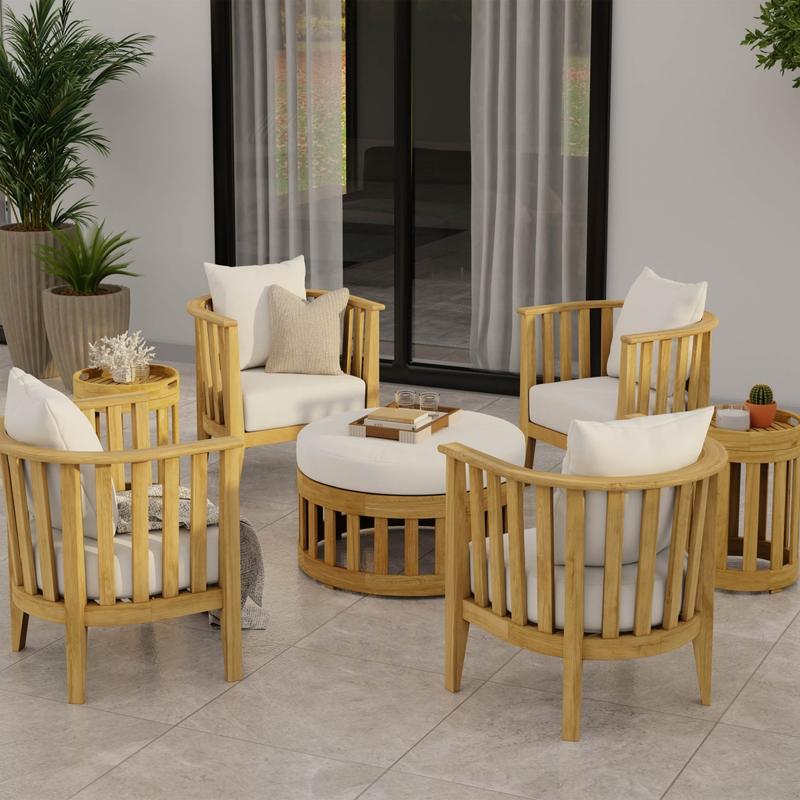 alt="70271 Kafelonia 7 piece Lounge Set on patio with books on ottoman and plants on side tables showing glass door and 2 potted plants in background"