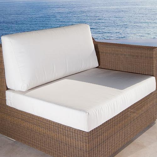 alt="73104MTO Malaga Left Side Sofa Cushion on Malaga left side sofa on concrete deck in front of pool with ocean and blue sky background"