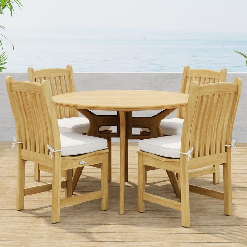 alt="70356 Veranda Surf 5 pc Cafe Dining Set of a Surf 42 inch round dining table and 4 Veranda Side Chairs with optional seat cushions side view on wood deck with ocean background  "