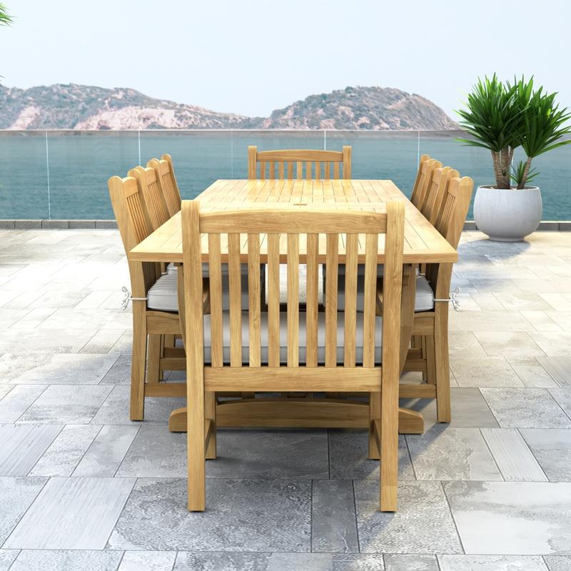 alt="70792 Veranda 9 pc Teak Dining Set with optional seat cushions end view showing a potted plant and ocean view in background "