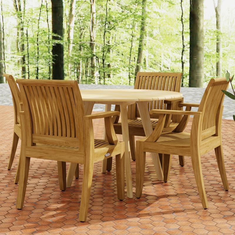 alt="70544 Laguna  Surf 5 pc Dining Set of Surf 42 inch Round Table and 4 Laguna Dining Armchairs in side view on tiled patio with woods in background "