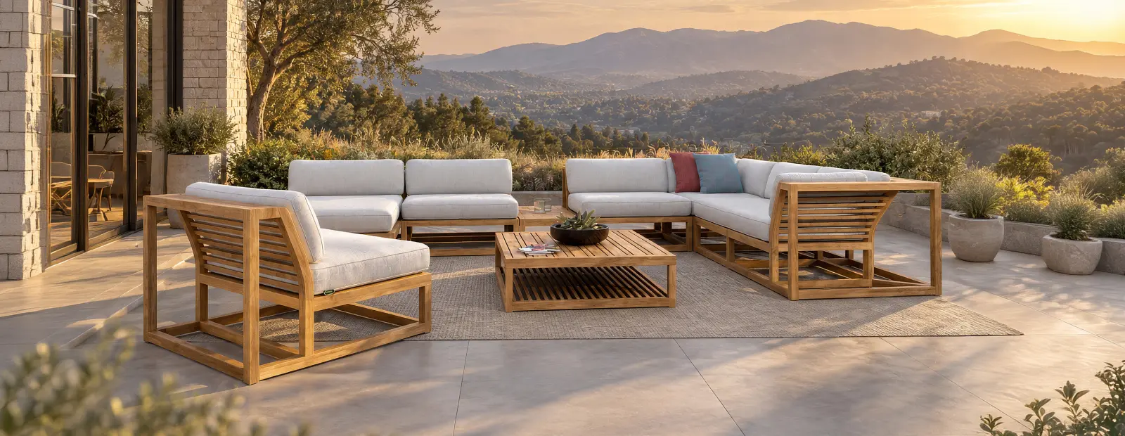 Teak outdoor lounge Maya Set with deep cushions on a patio at golden hour