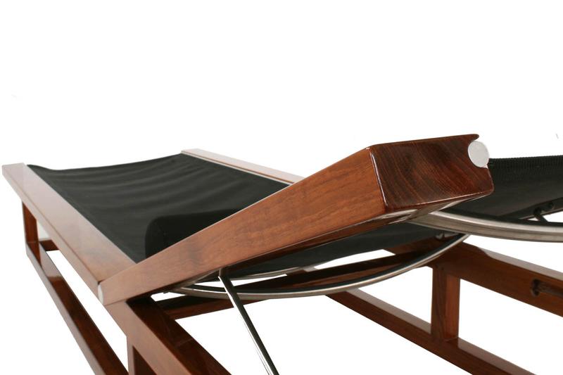 alt=" 16771 Maya Chaise Lounger in black Textilene mesh fabric and bolster cushion in our marine gloss finish close up view of back rest teak frame on a white background "