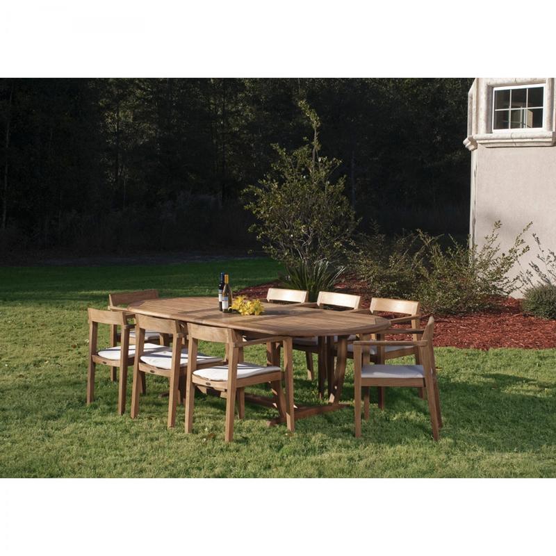 alt="70255 Montserrat Horizon 9 piece Teak Dining Set with optional seat cushions on grass field with trees and shrubs in background"