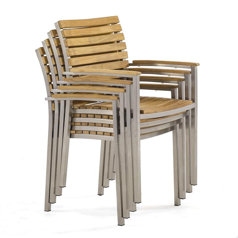 alt="70668 Vogue teak and stainless steel stacking dining chair stacked 4 high angled side view on white background"