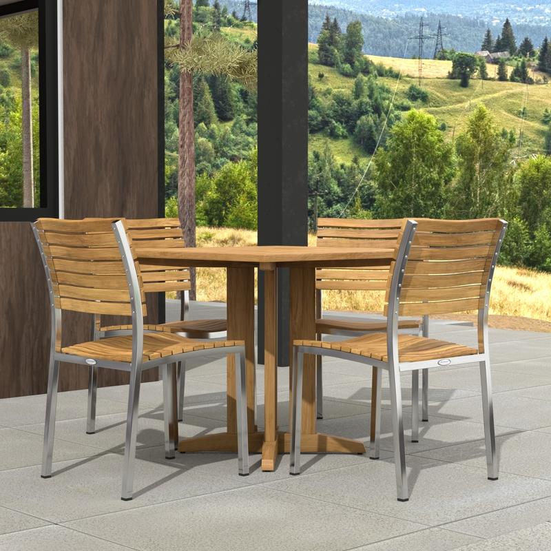 alt="70574 Vogue Pyramid 5 pc Cafe Set of Pyramid Dining Table and 4 Vogue Side Chairs angled side view on tiled patio next to a wall and window with hills in the background"