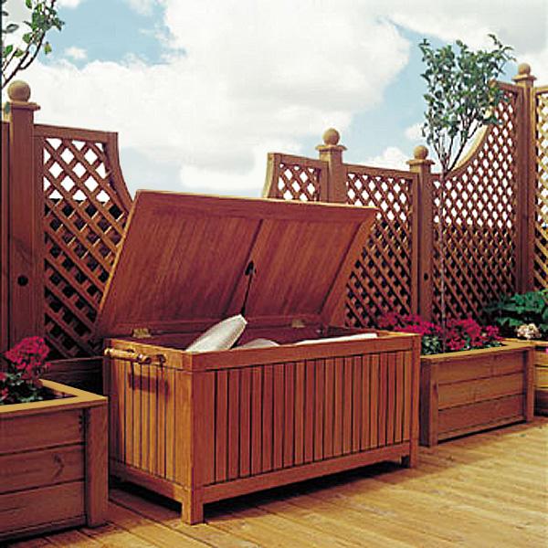 alt="18203 somerset storage box on wood deck with flower boxes on both sides and lattice fence in background"