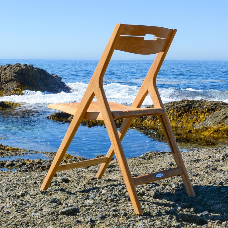 alt="11916 Surf Side Chair on beach facing ocean and blue sky background"