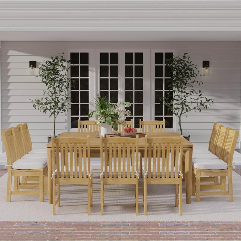 alt="70879 Veranda 13 piece teak Square Dining Set of 12 teak side chair and 6 foot square dining table with bowl of apples on covered lanai with potted plants and french doors in background "
