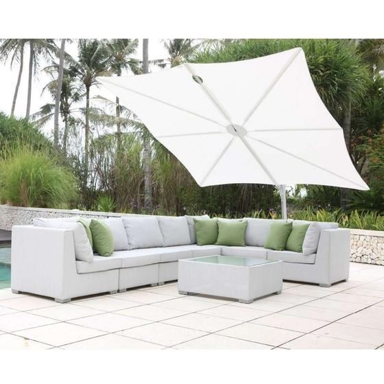 sp2590set spectra solo umbrella and paver base with sectional set on concrete patio with pool on one side trees and shrubs in background