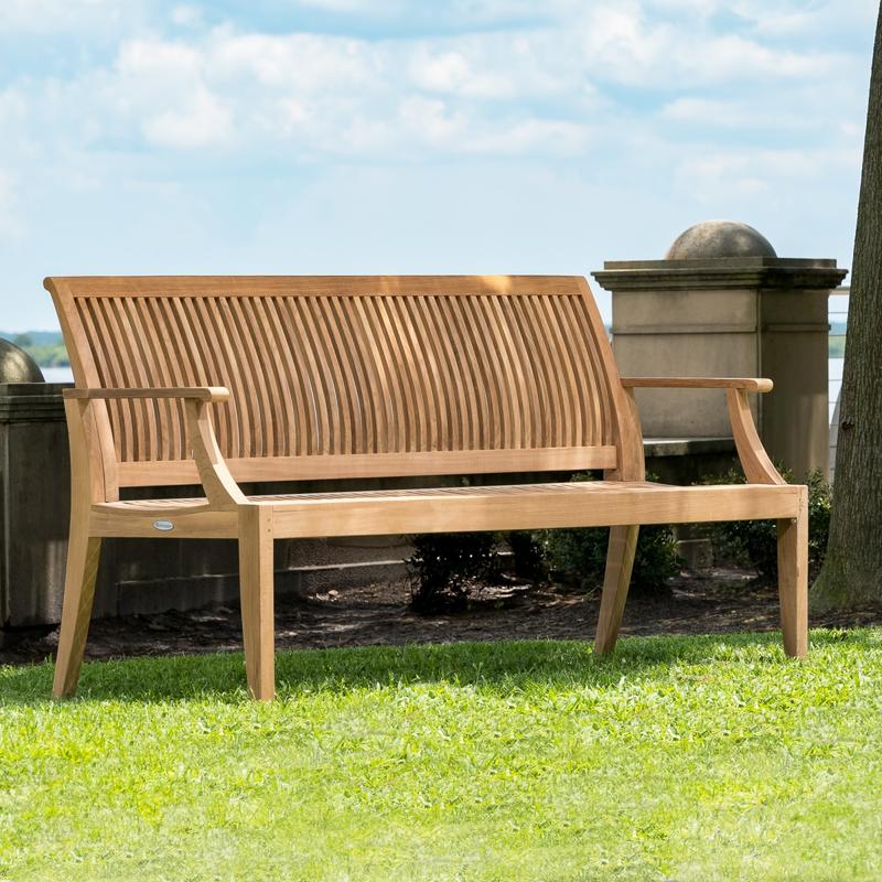alt="13812 Laguna 5 foot long Teak Bench on grass field with concrete low wall in background"