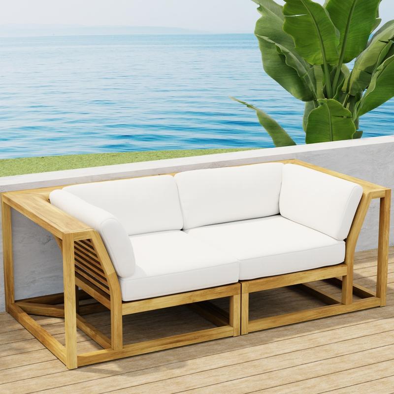 alt="70275  Maya Love Seat of 2 Maya Corner Sectionals in angled front view on wood deck with a plant and ocean and blue sky in the background"