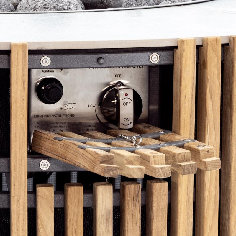alt="14100 Agora Round 40 inch table closeup side view showing slatted teak exterior and the igniter switch"