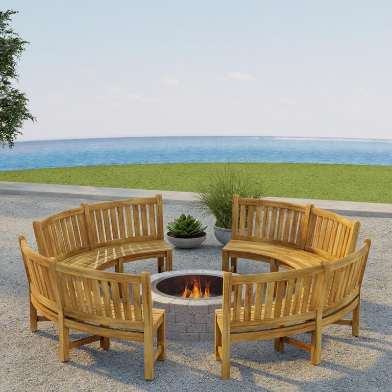 alt="70657 Buckingham Bench Set of 4 around a firepit on outdoor patio next to 2 potted plants in angled aerial view with grass lawn and ocean in the background"
