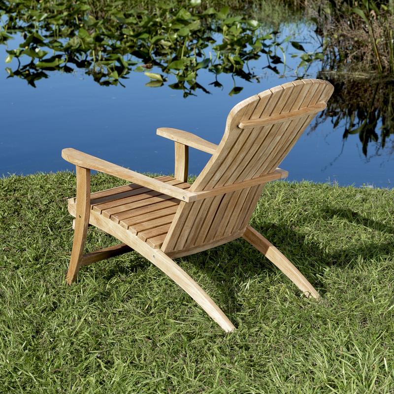 alt="70000 teak Adirondack Chair and footrest with cushions side angled on white background"