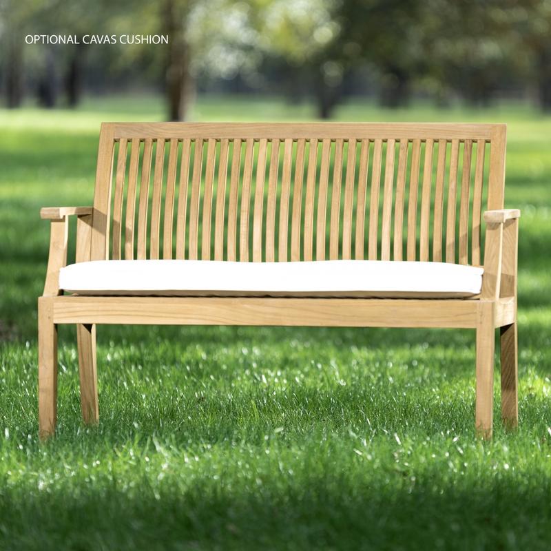 alt="13810 Laguna 4 foot Teak Bench with optional seat cushion front view on grass field with trees in background"