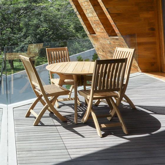 70825 Barbuda Surf 4 piece Dining Set of 4 folding side chairs and round 42 inch dining table on a wooden deck overlooking trees