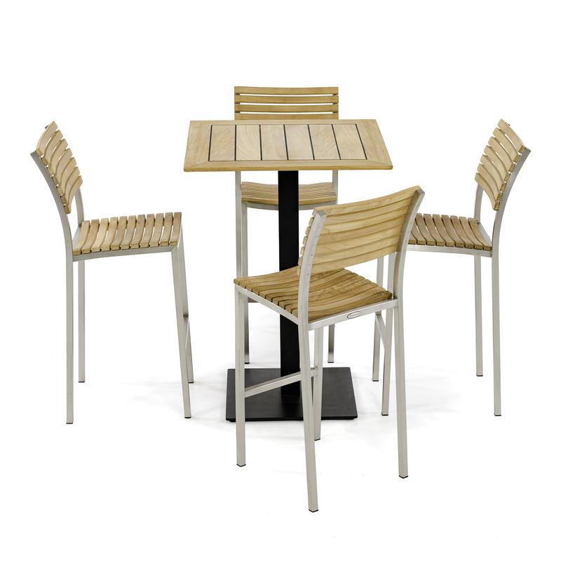 alt="70687 Vogue 5 pc Bar Furniture Set of a Teak 30 inch Square Table Top on black base and 4 Vogue Teak and Stainless Steel Barstools aerial side view on white background"