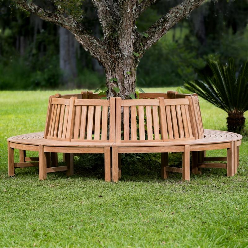 alt="13691 Teak Tree Hugger Bench 5 sections around tree on grass with trees in background"
