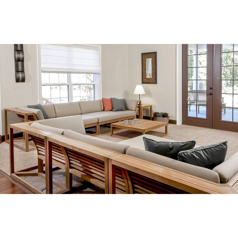 alt="70233 Maya Deep Seating 7 Piece Teak Sofa Set interior angled view on carpet lamp on side table wall mirror galvanized bucket with rolled towels on floor windows and door to outside"