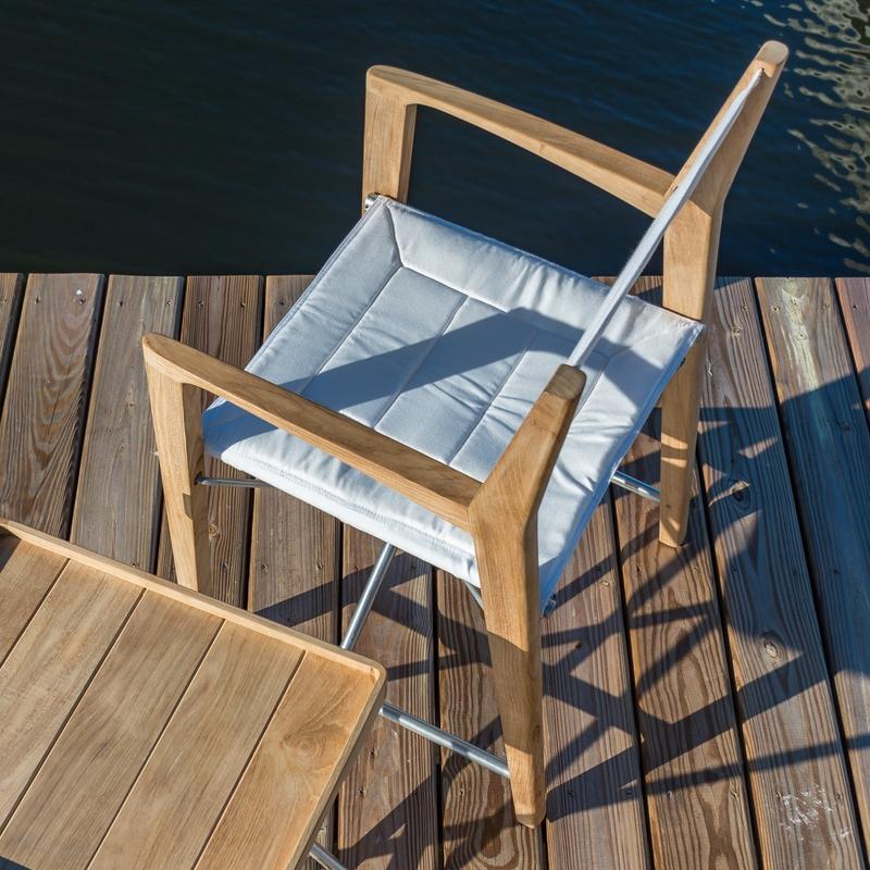 alt="12915F Odyssey Chair in aerial view on wood dock next to Odyssey Side Table"