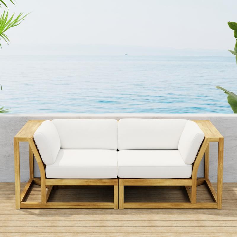 alt="70275  Maya Love Seat of 2 Maya Corner Sectionals in front view on wood deck with ocean and blue sky background"