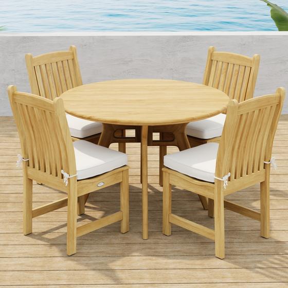70356 Veranda Surf 5 pc Cafe Dining Set showing a Surf 42 inch round dining table and 4 Veranda Side Chairs with optional seat cushions side angled view on wood deck with ocean background  