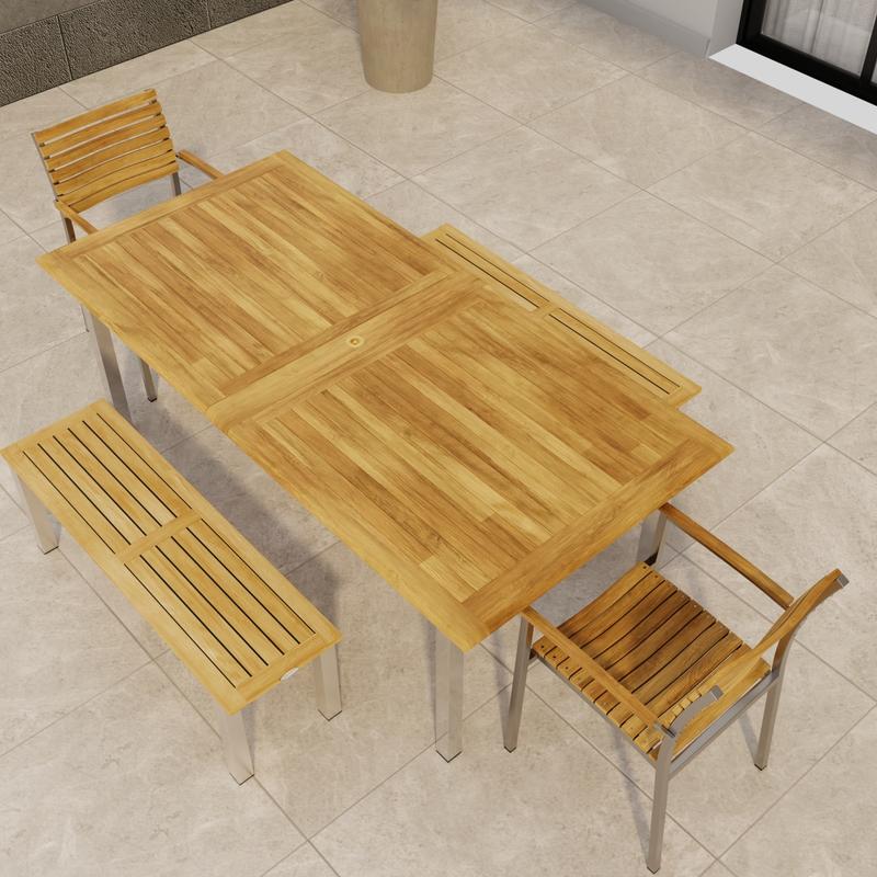 alt="70445 Vogue Bench Dining Set of a Vogue stainless steel and teak Extension Table and 2 Dining Chairs and two 4 ft  Backless Benches in angled aerial view of table top on tiled patio"