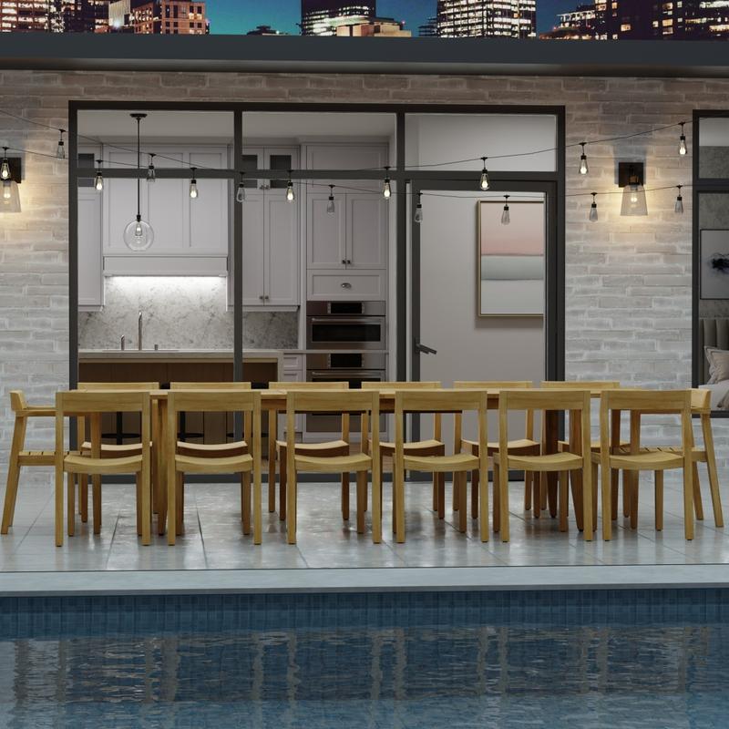 alt="70353 Laguna 15 pc Teak Dining Set of 14 dining armchair and rectangular 11 foot extendable dining table angled side view in front of glass doors in the background "