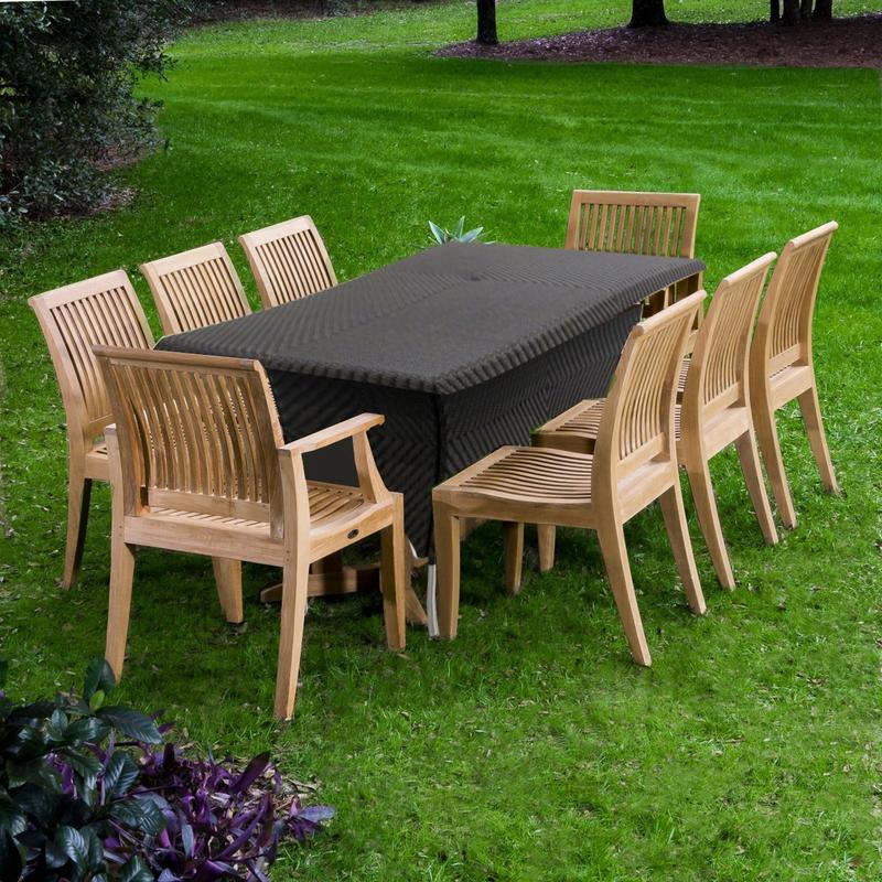 alt="70294 Laguna Valencia 9 piece teak Dining Set of 2 Laguna dining chairs and 6 Laguna dining side chairs and Valencia synthetic wicker 79 inch rectangular table on grass with trees in back"