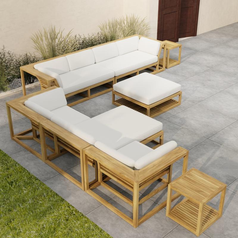 alt="70233 Maya 7 pc Sectional Furniture Set in angled aerial view on a patio with landscape plants and a privacy wall and door in the background"