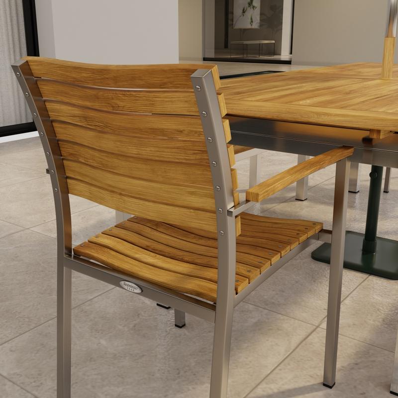 alt="70445 Vogue Bench Dining Set showing closeup partial end view of Stainless Steel and Teak Extension Table and back of Dining Chair on a tile patio with a window of house in background"