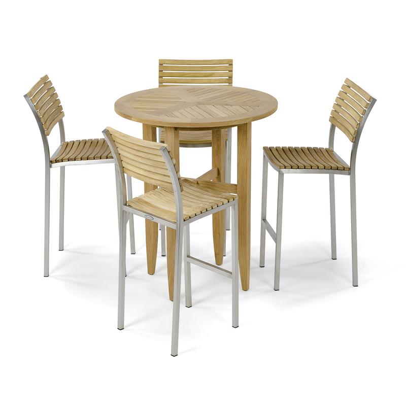 alt="70683 Laguna Round Vogue 5 pc Teak Barstool Set of Laguna 36 inch round teak bar table and 4 Vogue Teak and Stainless Steel Side Bar Stools angled on white background "