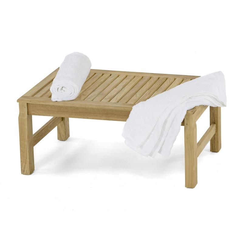 alt="13067 Ocean teak 3 foot long backless Bench angled view with 2 white towels 1 rolled and 1 opened laying on seat on white background"