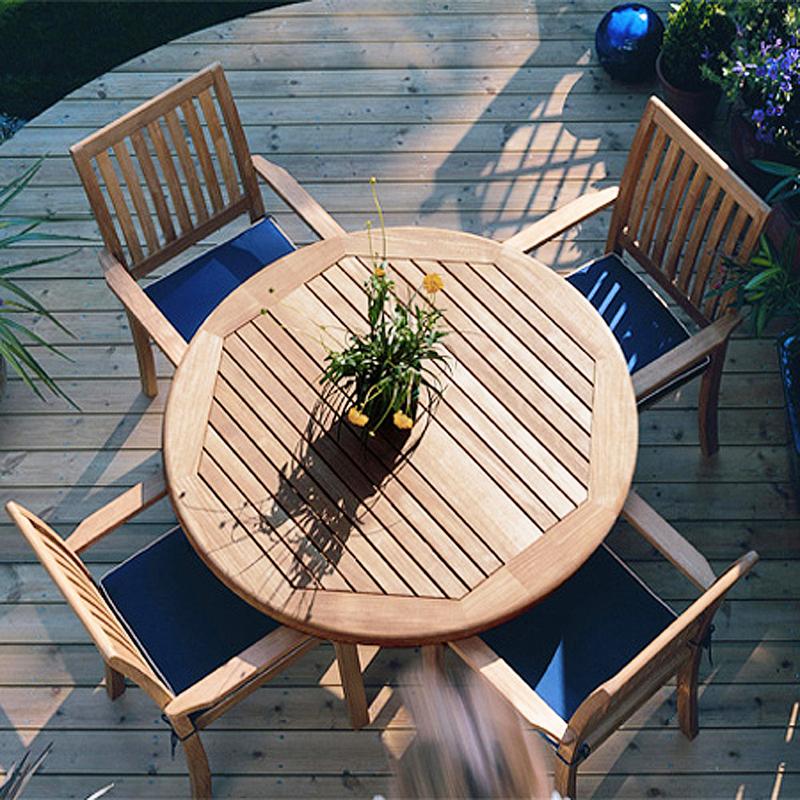alt="12196 Sussex teak stacking armchair with pyramid teak dining table on white background"