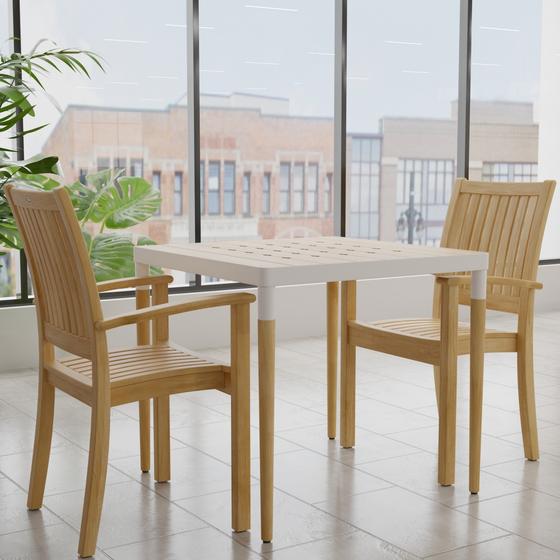 70907 Bloom Sussex 3 pc Dining Set angled corner view on tiled floor with 2 plants and windows in background