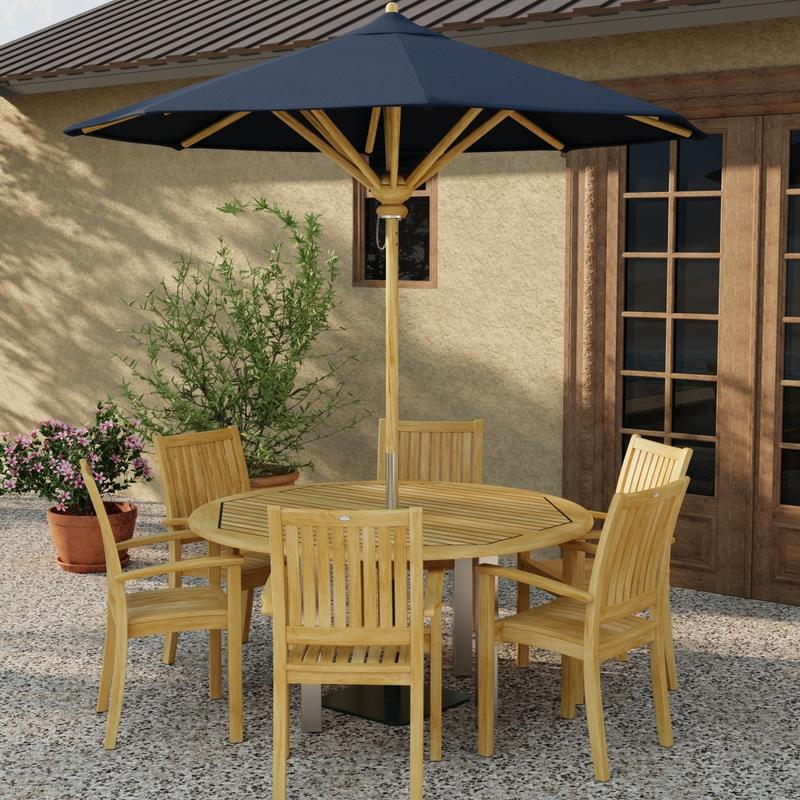 alt="70358 Vogue Sussex 7 pc Dining Set with optional opened umbrella in table center in angled side view on patio with 2 potted plants next to window and french door in background"