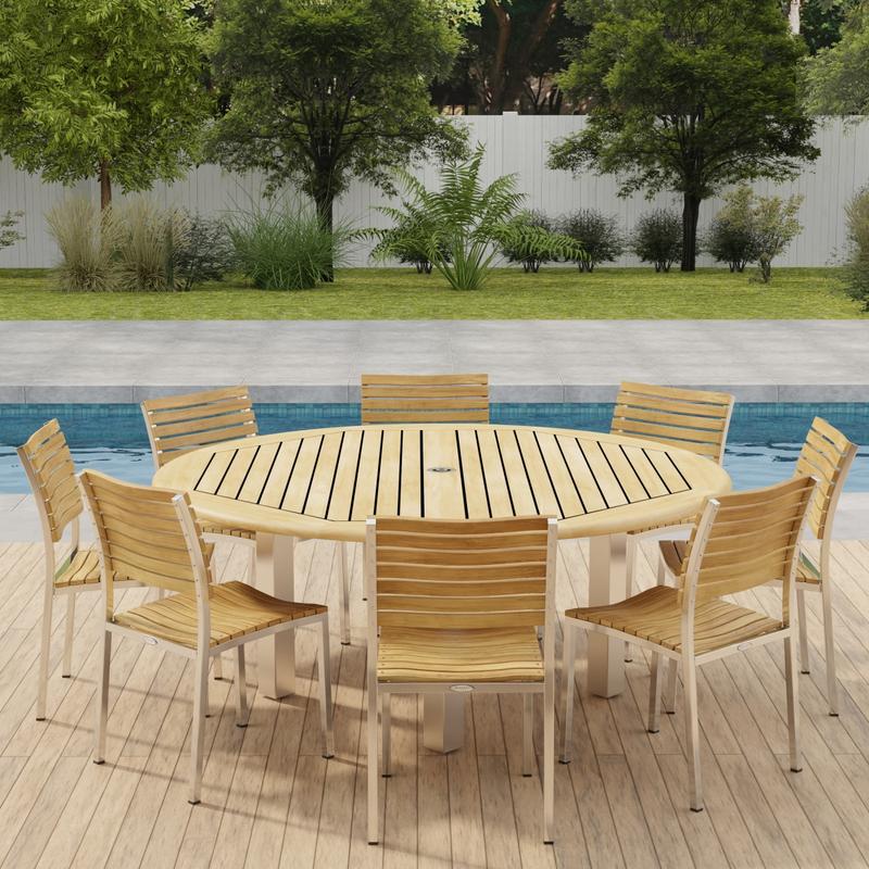 alt="70444 Vogue Teak Dining Set for 8 in angled side view on outdoor deck in front of a pool with a fence and plants and trees in background "