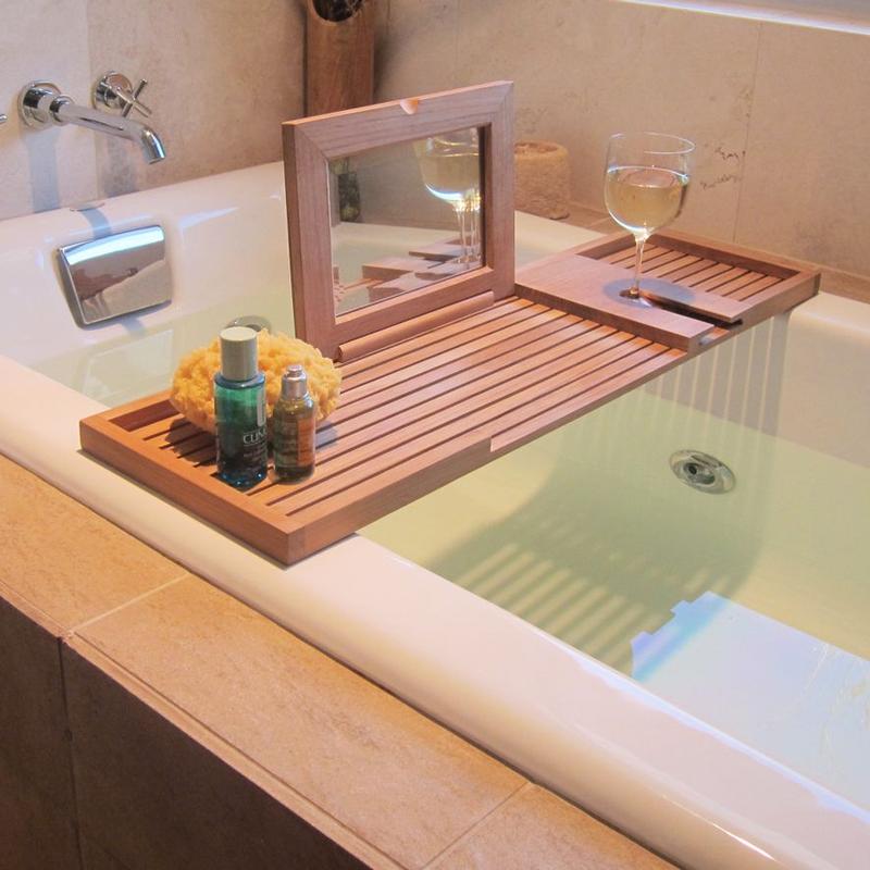 alt="18816 Pacifica teak Bathtub Tray mirror opened glass of wine sponge and toiletries on tray sitting on a bathtub "