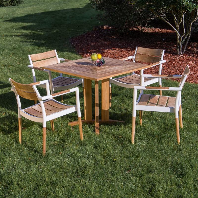 alt="70452 Bloom Pyramid Bistro Dining Set of 4 Bloom teak and powder coated aluminum dining chairs and Pyramid 36 inch square teak dining table bowl of fruit on grass with trees in back "