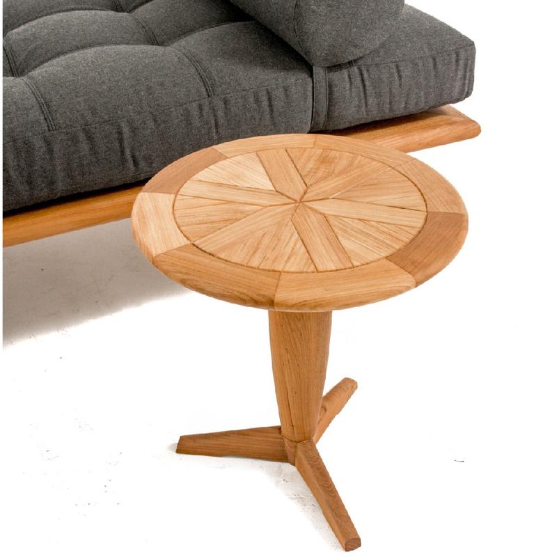 alt="16815dp saloma teak daybed with cushion angled beside teak round side table on white background"