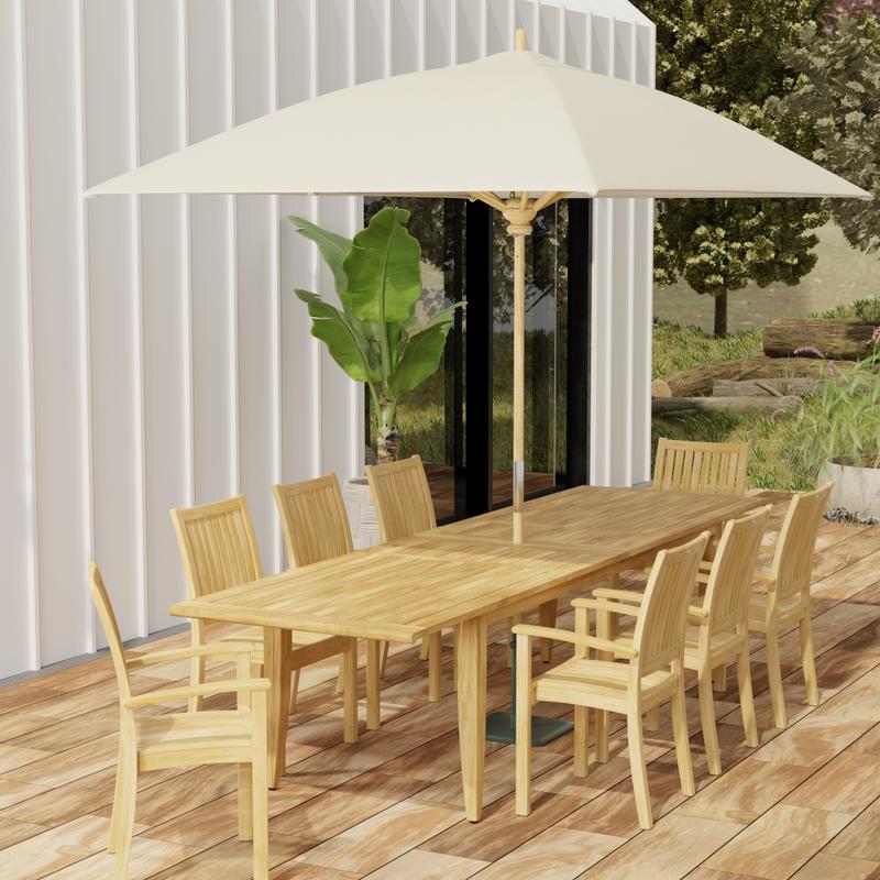 alt="70774 Laguna Sussex 9 pc Teak Dining Set with optional umbrella in angled end view on patio with potted tree and house in background"