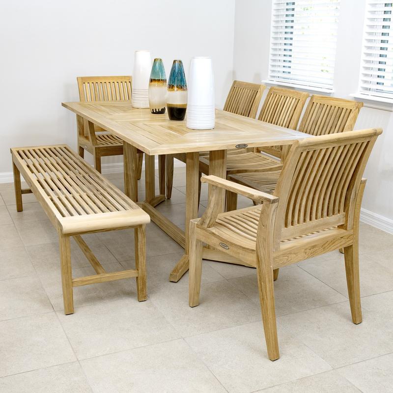 alt="13917 Laguna 6 foot teak Backless Bench with Pyramid dining set on tile in dining room with 2 blue colored vases on table top and windows in background"