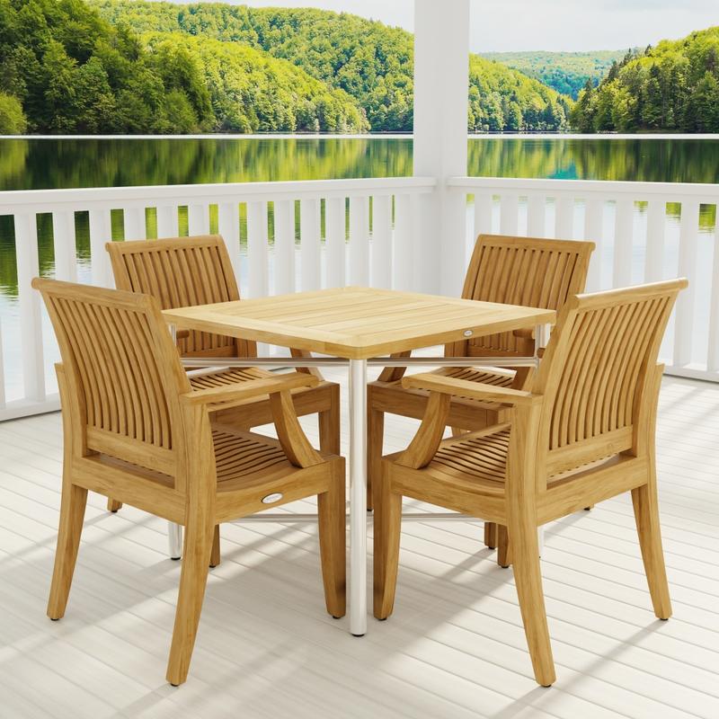 alt="70598 Odyssey Laguna Dining Chair Set of Odyssey Table and 4 Laguna Dining Chairs angled view on patio with railing and column in background overlooking hillside "