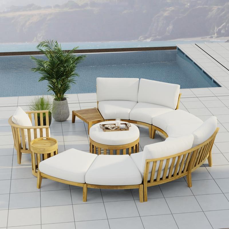 alt="70940 Kafelonia 6 piece Sofa Sectional Set in angled aerial view on outdoor patio next to 2 potted plants and pool with hazy mountain view in background"