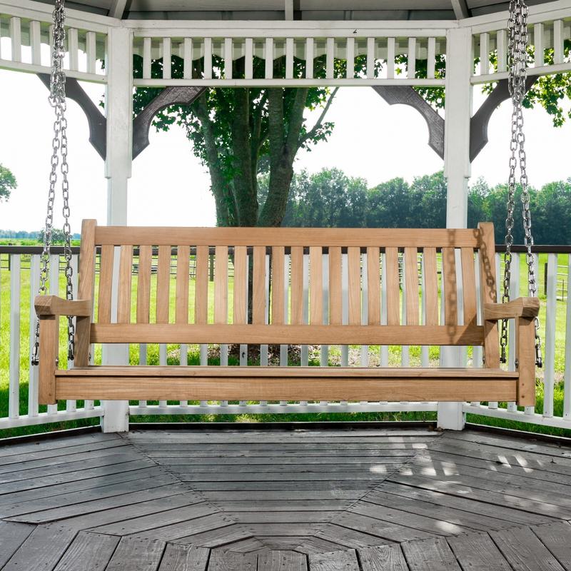 alt="13955bo swinging veranda teak bench in gazebo overlooking grass and barn in background"