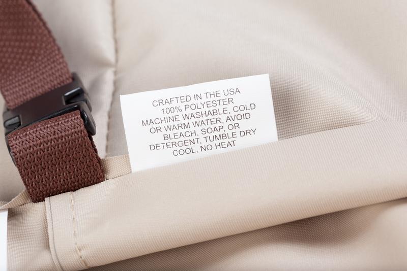 alt="62152DP Laguna Lounge Chair Cover showing closeup of cover label and securing clasp"