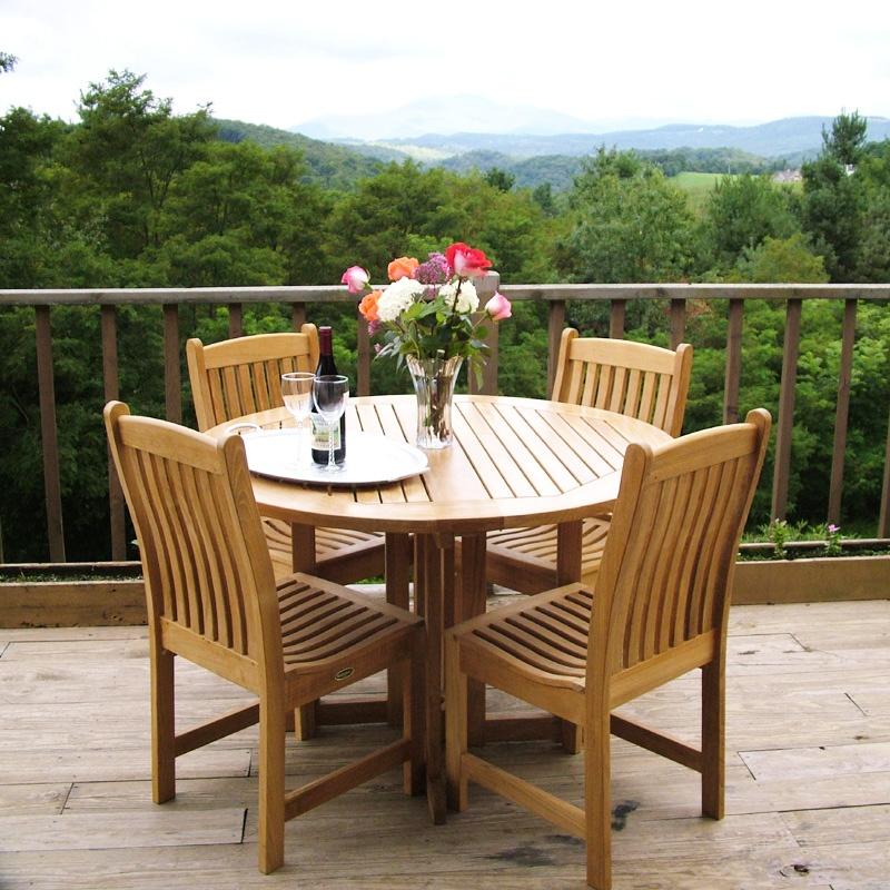 alt="70054 veranda side chairs around barbuda 4 foot folding table on deck with mountainview background"