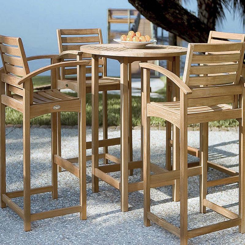 alt="70013 Somerset teak 5 piece Bar Table Set of 4 bar stools and 36 inch round bar table on patio with bowl of oranges on table with grass area and ocean in background"